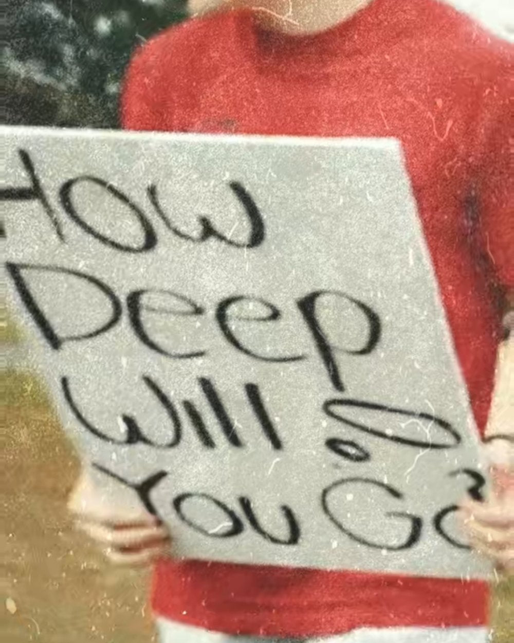A hand-painted How Deep Will You Go sign from the early days